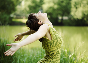 Happy woman with open arms after successful depression therapy in Westchester County