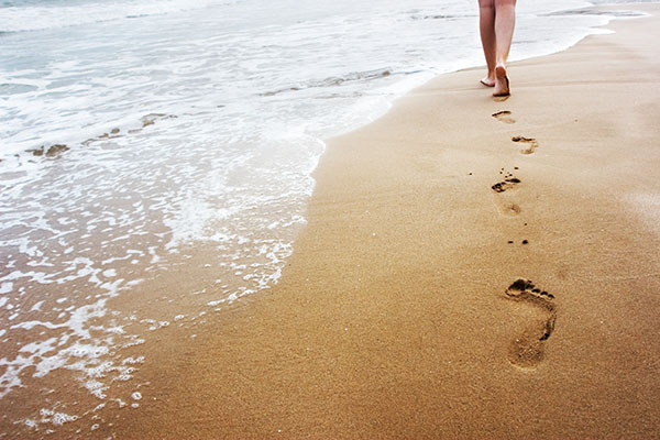 Child walking on beach